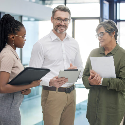 Shot of a group of businesspeople meeting and using a digital tablet. Shot of a group of businesspeople meeting and using a digital tablet.