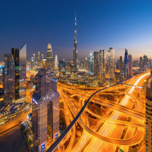 Aerial view of Dubai Downtown skyline, highway roads or street in United Arab Emirates or UAE. Financial district and business area in smart urban city. Skyscraper and high-rise buildings at night. Aerial view of Dubai Downtown skyline, highway roads or street in United Arab Emirates or UAE. Financial district and business area in smart urban city. Skyscraper and high-rise buildings at night.